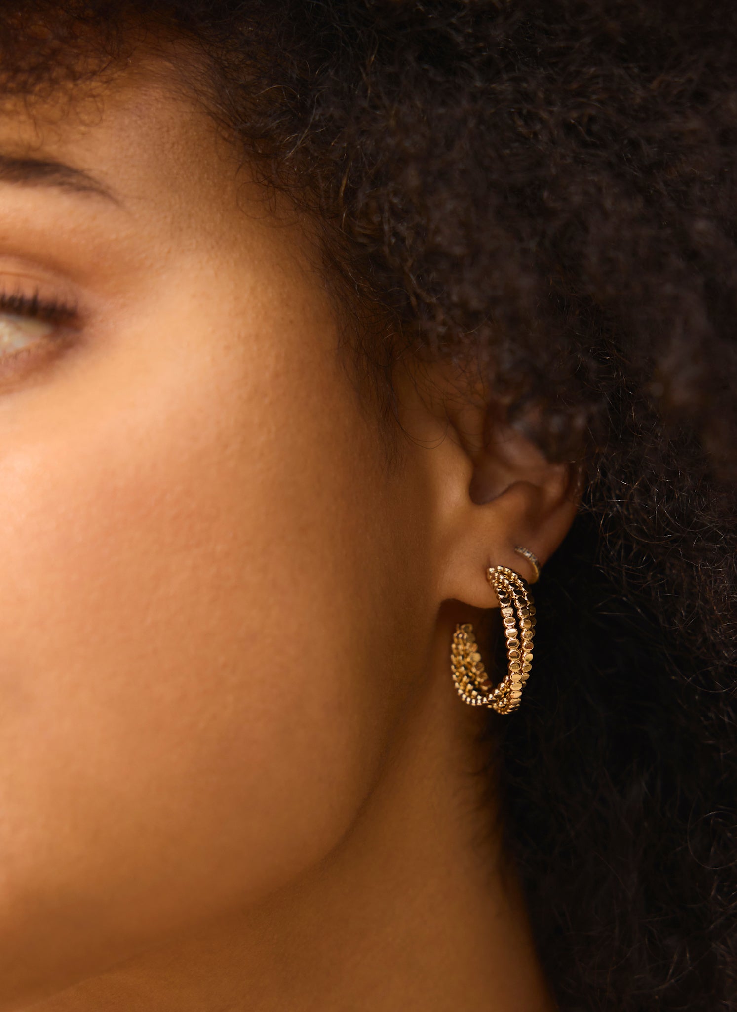 Gold Tone Crossover Hoop Earrings